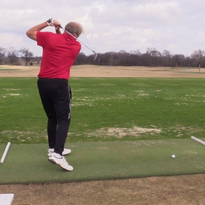 Men practicing golf swing