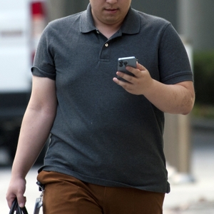 Man walking with cell phone