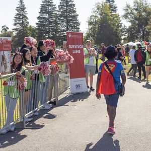 A survivor walks toward the finish line at the 2023 Kern County Heart and Stroke Walk