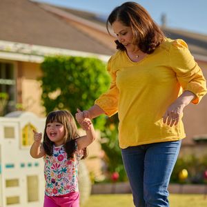 Erika playing with her daughter outide