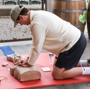 Hunter Collier practices Hands-Only CPR 